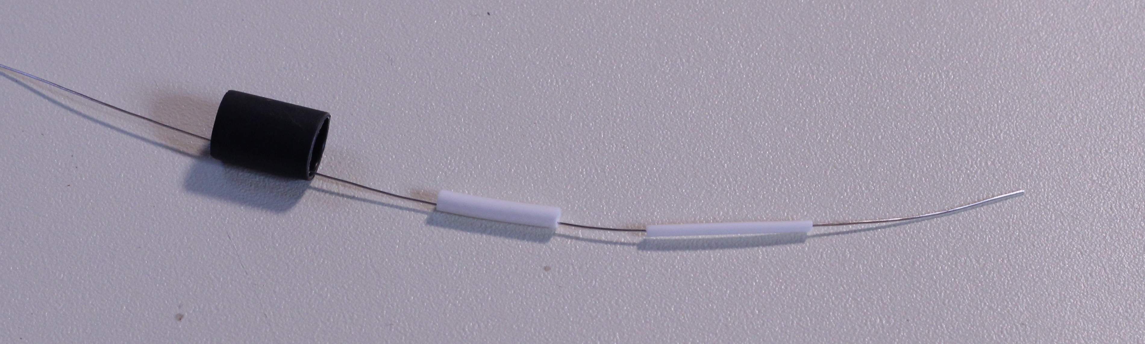 Coaxial cable with strain relief tubing.