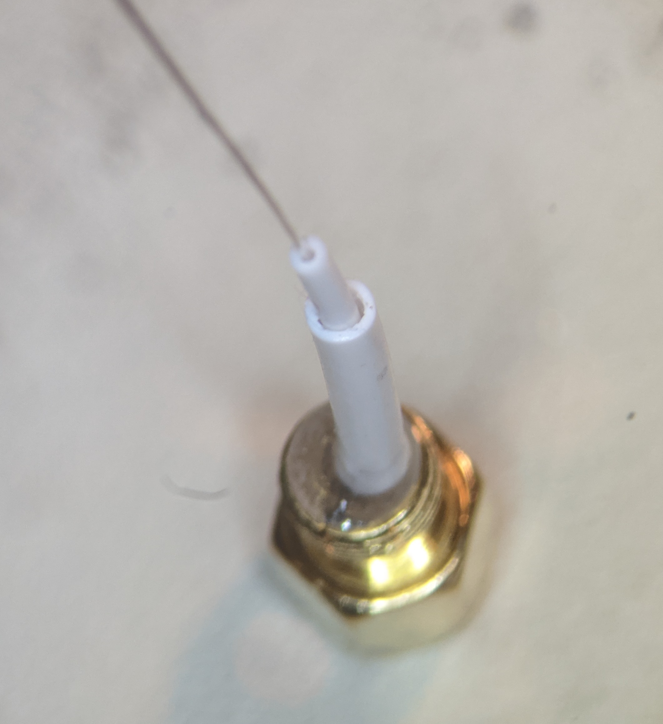 Coaxial cable outer soldered onto the SMA adapter with thin silicone tube.